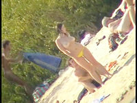 Its only a yellow bikini panty that covers chicks body on the beach.