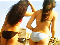 This is the exciting video that features two sexy amateur chicks in black and white bikini panty on the hotly waving butt cheeks