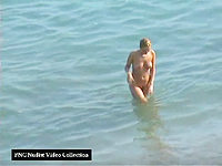 The charming nudist lady is walking from the water like a real mermaid!